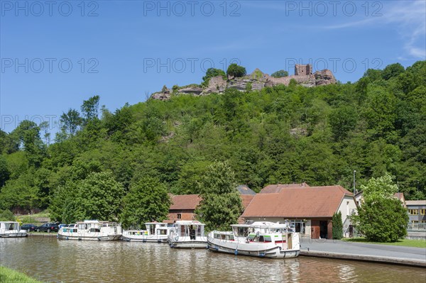 View of the ruins of Luetzelburg and houseboats on the Rhine-Marne Canal, Lutzelbourg, Lorraine,