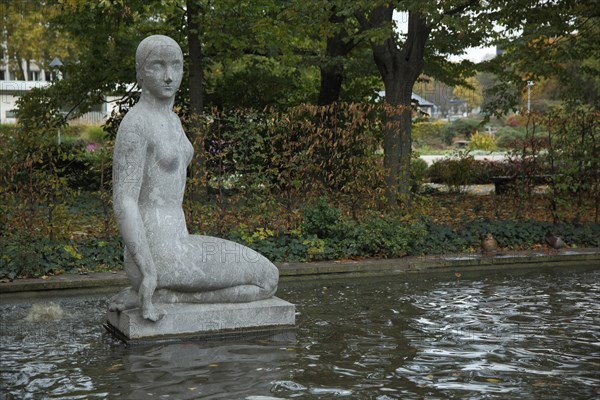 Spring nymph by Arnold Hensler 1912 at the water basin, kneeling, nymph, grey, stone,