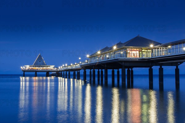 Heringsdorf Pier, Seebruecke Heringsdorf illuminated at night in the Baltic Sea on the island of