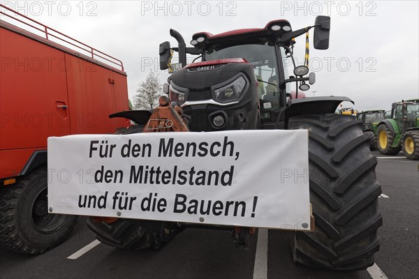 For the middle class, sign on a tractor, farmers' protests, demonstration against policies of the