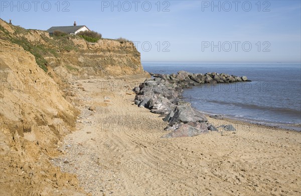 Rock armour used to defend soft crumbling cliffs, Happisburgh, Norfolk, England, United Kingdom,