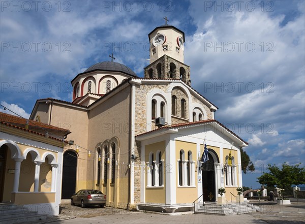 Orthodox church with a prominent bell tower surrounded by cobbled streets, Holy Church of the