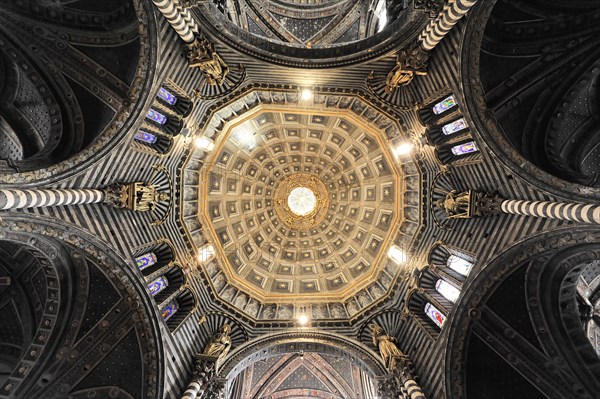 The dome of the cathedral with starry sky and black and white striped marble columns and round