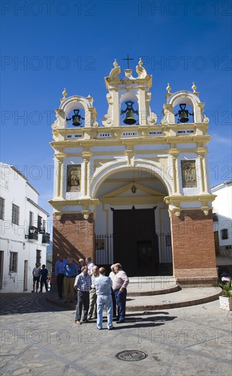 Men gather by the baroque church of San Juan at Zahara de la Sierra, Spain Sunday 13 October 2013