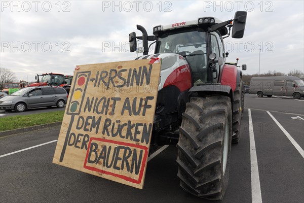 Not on the backs of farmers, placard on a tractor, farmers' protests, demonstration against