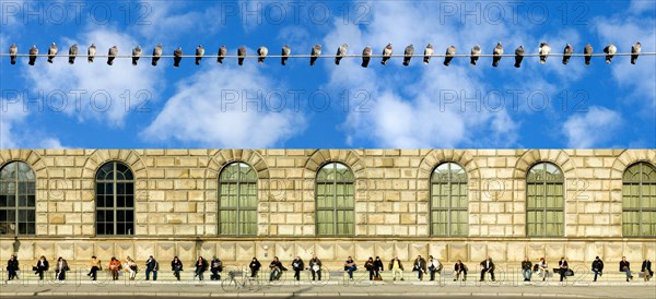 People sitting in the sun on an otherwise cool day, Max-Joseph-Platz, Munich, Bavaria, Germany and