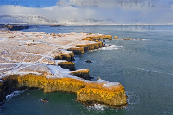 Aerial view over volcanic basalt cliff near Arnarstapi on the southern side of the Snaefellsnes