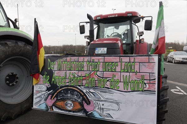 Sign with the theme Mittelstand on a tractor, farmers' protests, demonstration against the policy