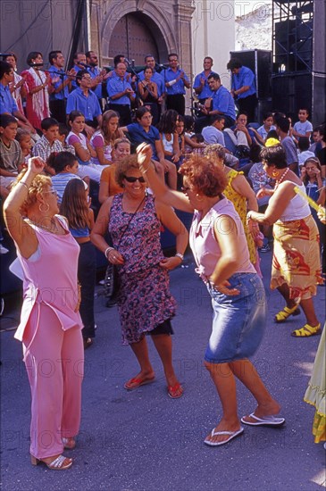 Elderly women dance flamenco at street party in Velez-Malaga, Andalusia, Spain, Southern Europe.