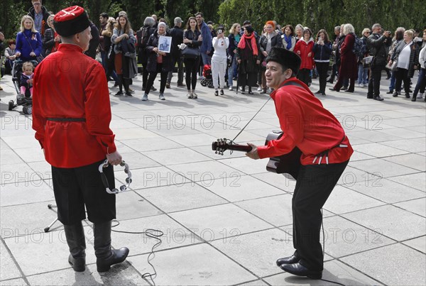 Musicians play Russian folk music on the 74th anniversary of the victory of Russia over Germany, at