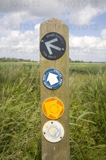 Route markers for Angles Way long distance footpath in marshes near Oulton Broad, Suffolk, England,