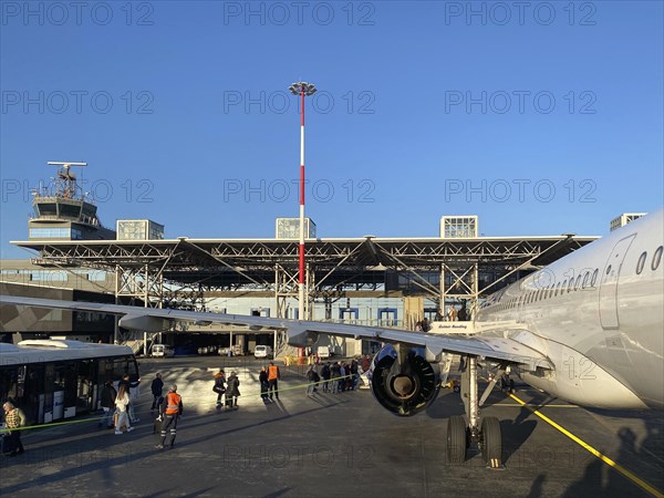 Passengers boarding the aircraft from the shuttle bus, Aegan Airlines, tarmac, Makedonia Airport,