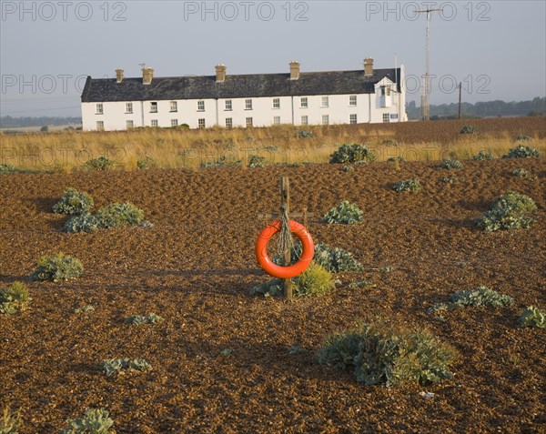 Row of white houses, Coastguard Cottages, at Shingle Street, Suffolk, England, United Kingdom,