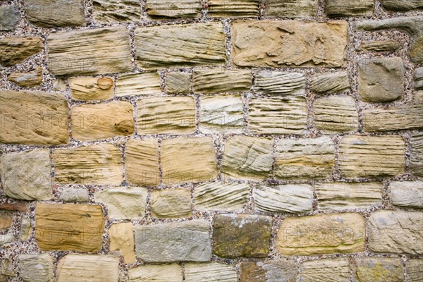 Grooves cut in sandstone blocks by wind erosion at Tynemouth priory, Northumberland, England,