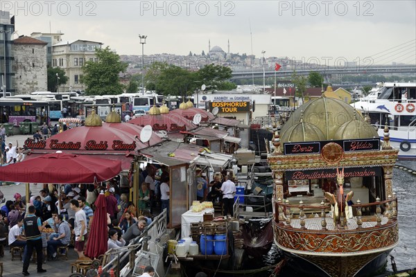 View from the Galata Bridge, Galata Koepruesue, on market and fish stall in Eminoenue