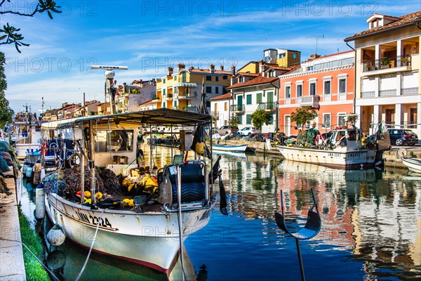 Fishing boats in the harbour, island of the lagoon town of Grado, north coast of the Adriatic Sea,