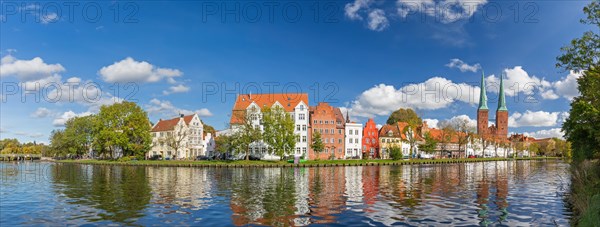 Historic houses and Luebeck Cathedral, Dom zu Luebeck, Luebecker Dom along the river Trave in the