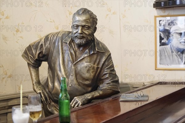 Bronze statue of Ernest Hemingway in the Bar Floridita, Hemingway's favourite bar, in the old town