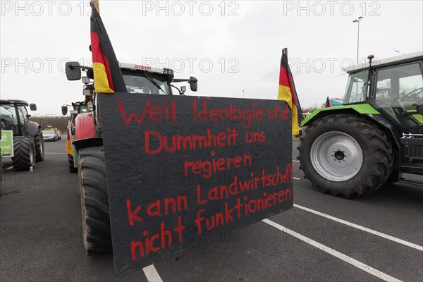 Sign criticising the government on a tractor, farmers' protests, demonstration against policies of