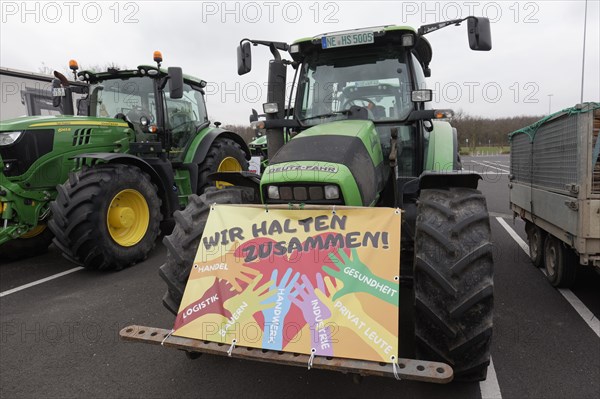 We stick together, sign on a tractor, farmers' protests, demonstration against policies of the
