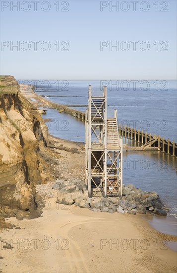 Former beach access stairs now stand alone as coastal erosion continues, Happisburgh, Norfolk,