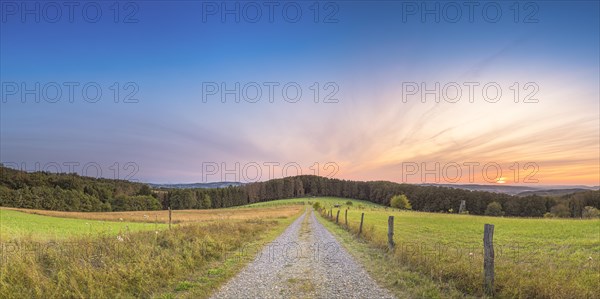 A path with a view of the Weserbergland, landscape, nature photograph, sunset, evening mood,