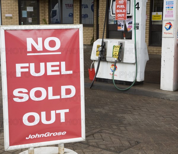 No Fuel Sold Out sign on petrol pumps in John Grose garage, Melton, Suffolk, England, United