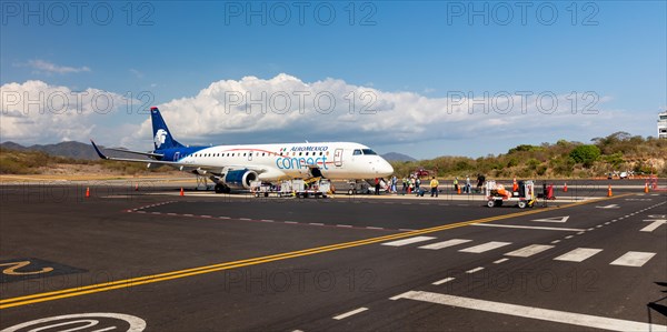 AeroMexico Embraer EJS-190 aircraft at the airport of Huatulco, Baja de Huatulco, South Pacific