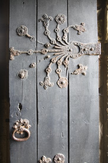 Ornate metalwork hinges on the door to the Percy family chapel, Tynemouth priory, Northumberland,