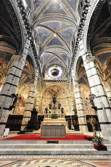 Altar area, The central nave of the cathedral with its black and white striped marble columns,