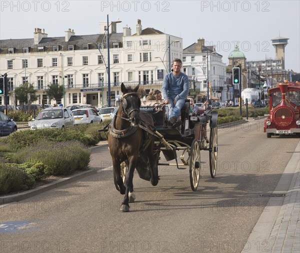 Horse and carriage ride along the seafront, Great Yarmouth, Norfolk, England, United Kingdom,