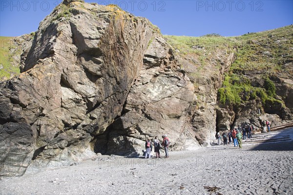 Student group of geologists on a fieldtrip at Polpeor Cove, Lizard Point, Cornwall, England, United