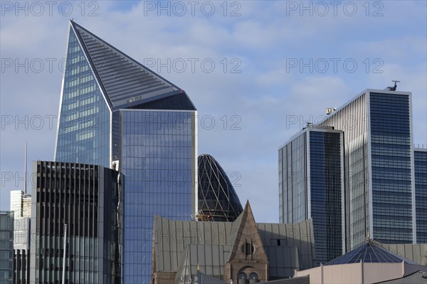 The Gherkin skyscraper building and nearby high rise office buildings, City of London, England,