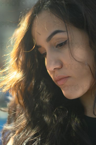 A contemplative woman bathed in soft natural light, exuding a gentle mood, a complete tool panel in