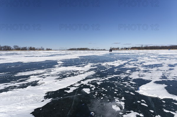 Winter, snow drifts on frozen riverscape, Saint Lawrence River, Province of Quebec, Canada, North