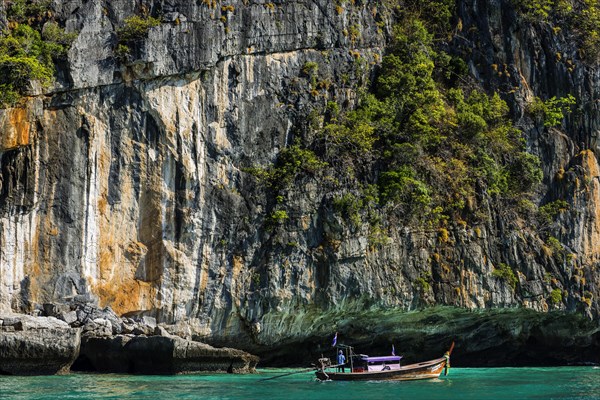 Fisherman on a longtail boat at Maya Bay, boat, wooden boat, local, tradition, Thai, Asian,