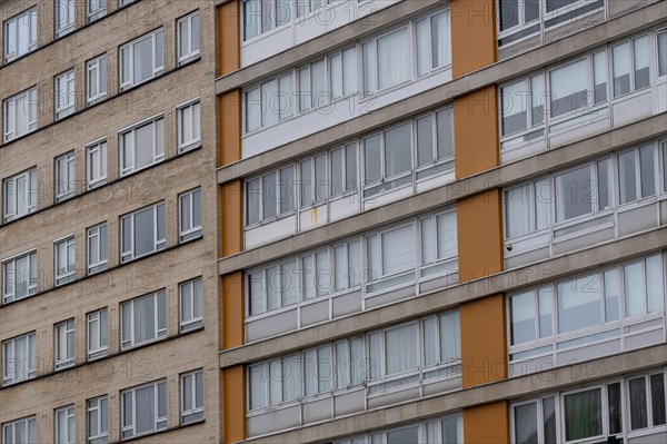 Urban apartment complex with orange-coloured balconies and many windows, Blankenberge, Flanders,