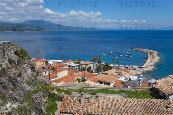 View of a Mediterranean coastal town with a harbour and boats on the sea, old town, Koroni,
