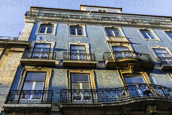 Old building, facade with typical azulejos, tiles in the old town, city, architecture, blue,