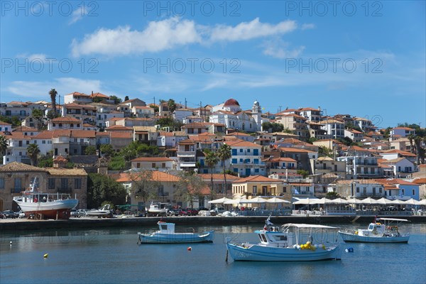A picturesque coastal town on a sunny day with boats in the water, Koroni, Pylos-Nestor, Messinia,