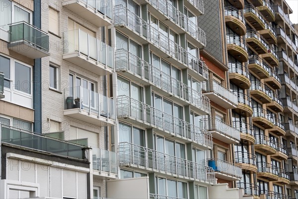 Stack of flat balconies with glass railings on a multi-storey building, Blankenberge, Flanders,