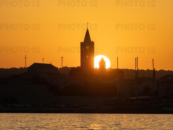 Sunset, silhouette of the church towers of Rab, town of Rab, island of Rab, Kvarner Gulf Bay,