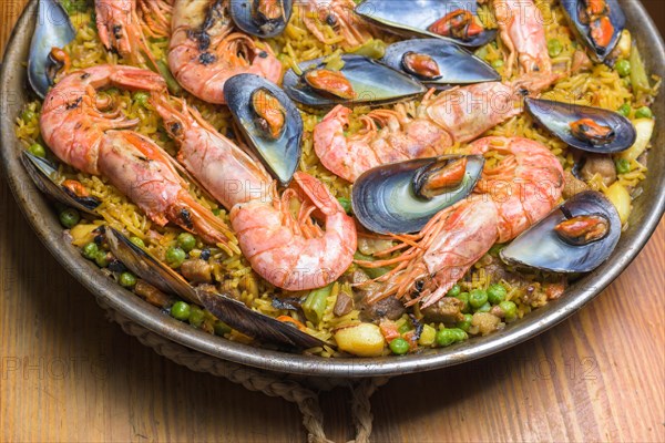 Brightly colored seafood paella presented in a traditional pan, typical Spanish cuisine, Majorca,