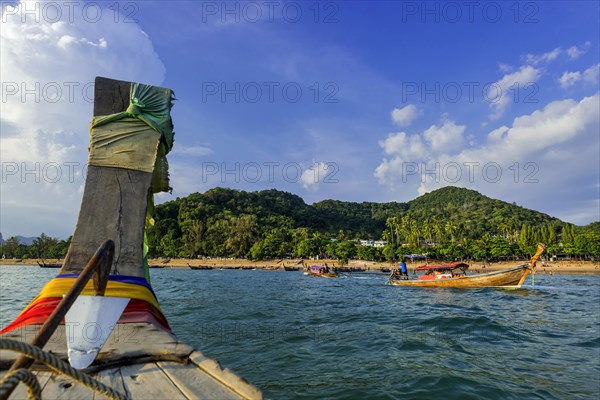 Longtail boat for transporting tourists, water taxi, taxi boat, fishing boat, wooden boat, boat,