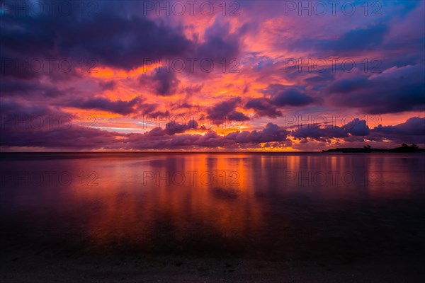 Beautiful sunset over ocean water taken from a beach in Guam
