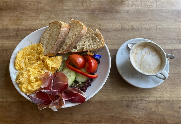 Food, breakfast, scrambled eggs, bread, South Tyrolean ham, tomatoes, gherkins, cappuccino,