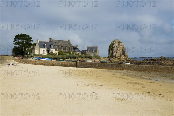 Houses and granite rocks on the beach, Plougrescant, Cote de Granit Rose, Cotes d'Armor, Brittany,