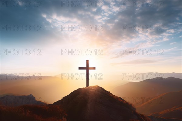 Silhouette of religious Christian cross on mountain top illuminated with sunlight. KI generiert,