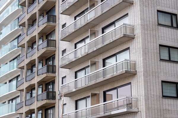 A section of a residential building with many balconies and a brick facade, Blankenberge, Flanders,