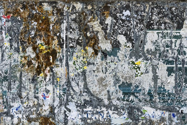 Old texture of a billboard, paper, colourful, torn, torn, texture, background, billboard, faded,